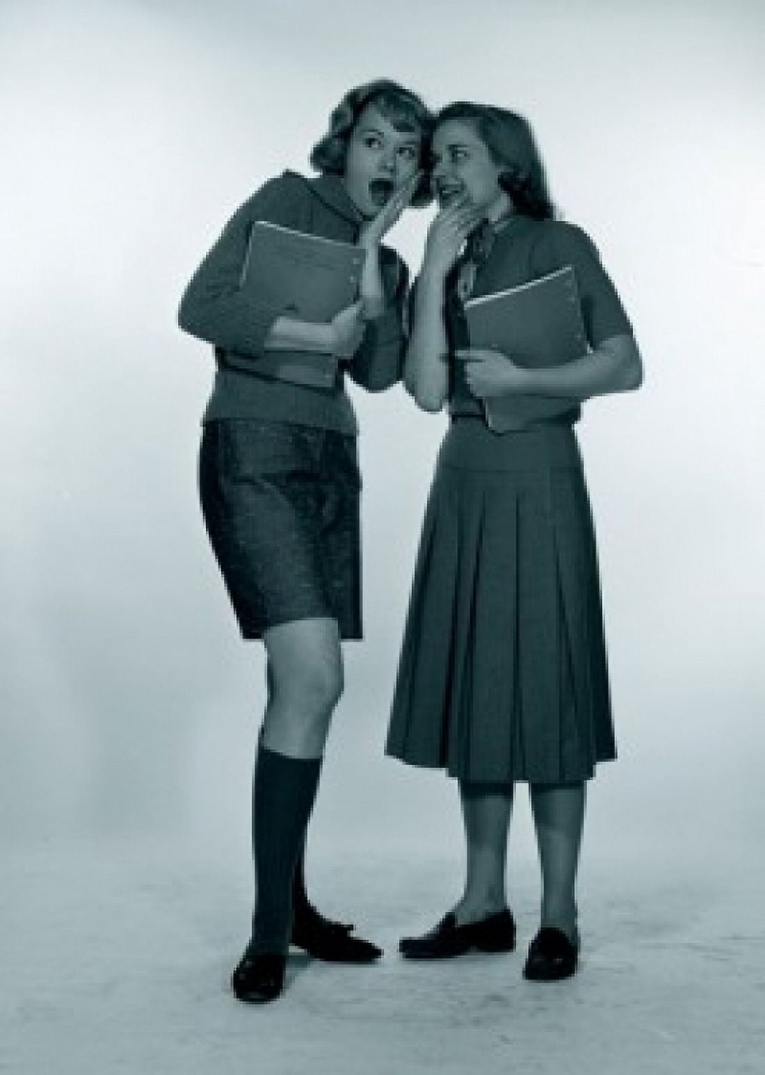 Studio shot of two female students gossiping Canvas Art - (24 x 36)