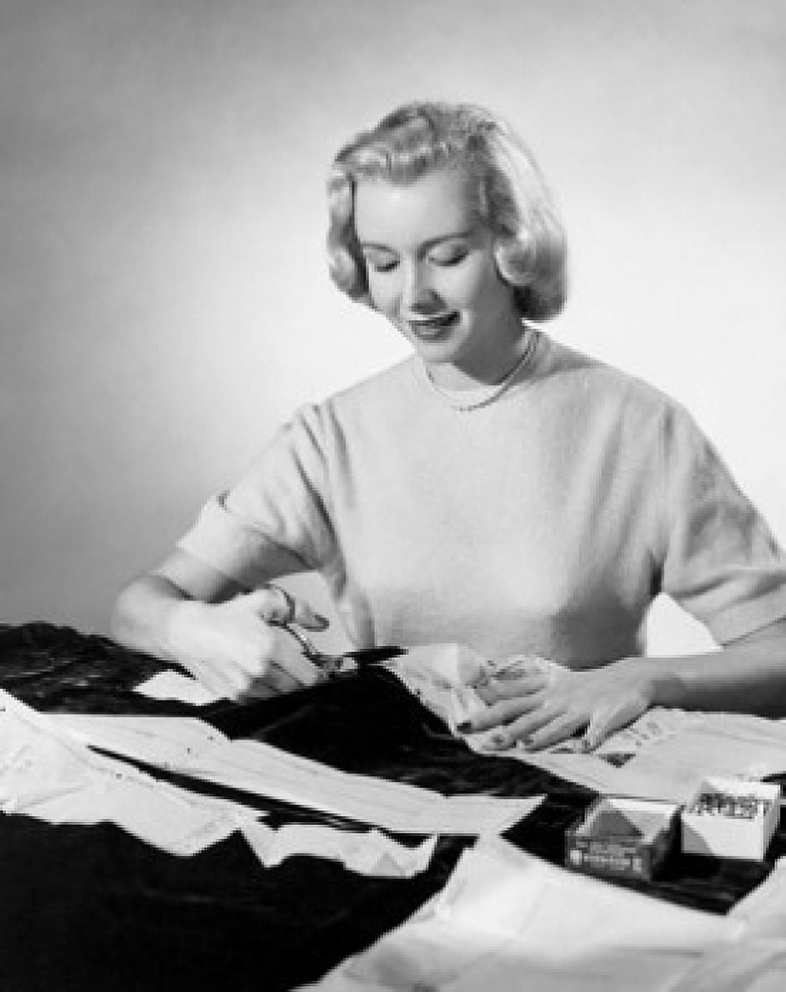Studio shot of young woman cutting cloth with scissors Canvas Art - (18 x 24)