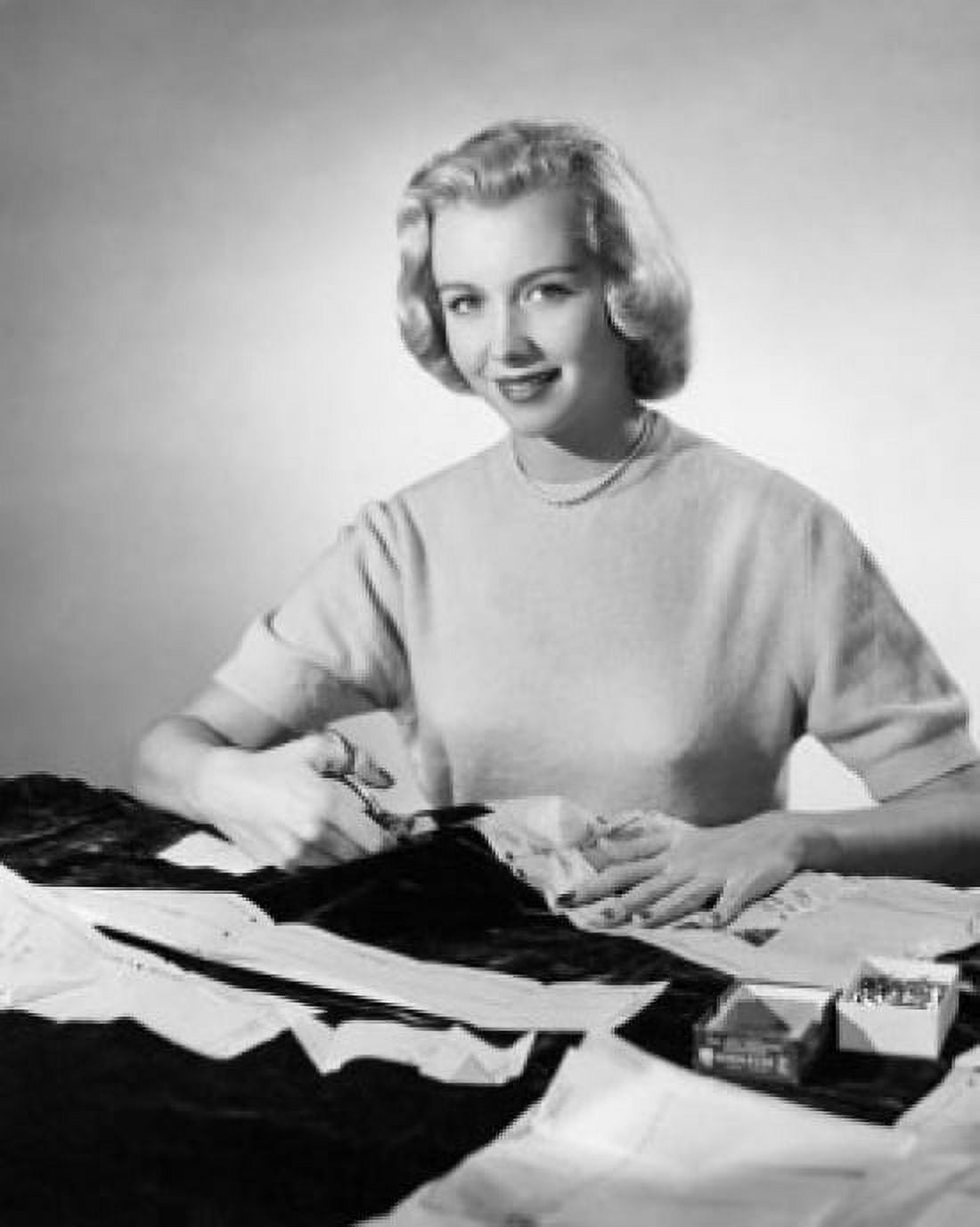 Studio shot of young woman cutting cloth with scissors Canvas Art - (18 x 24)