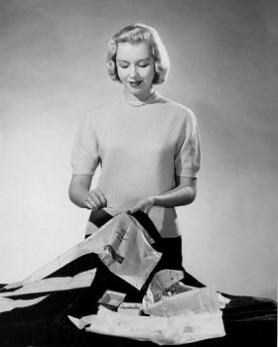 Studio shot of young woman sewing Canvas Art - (18 x 24)