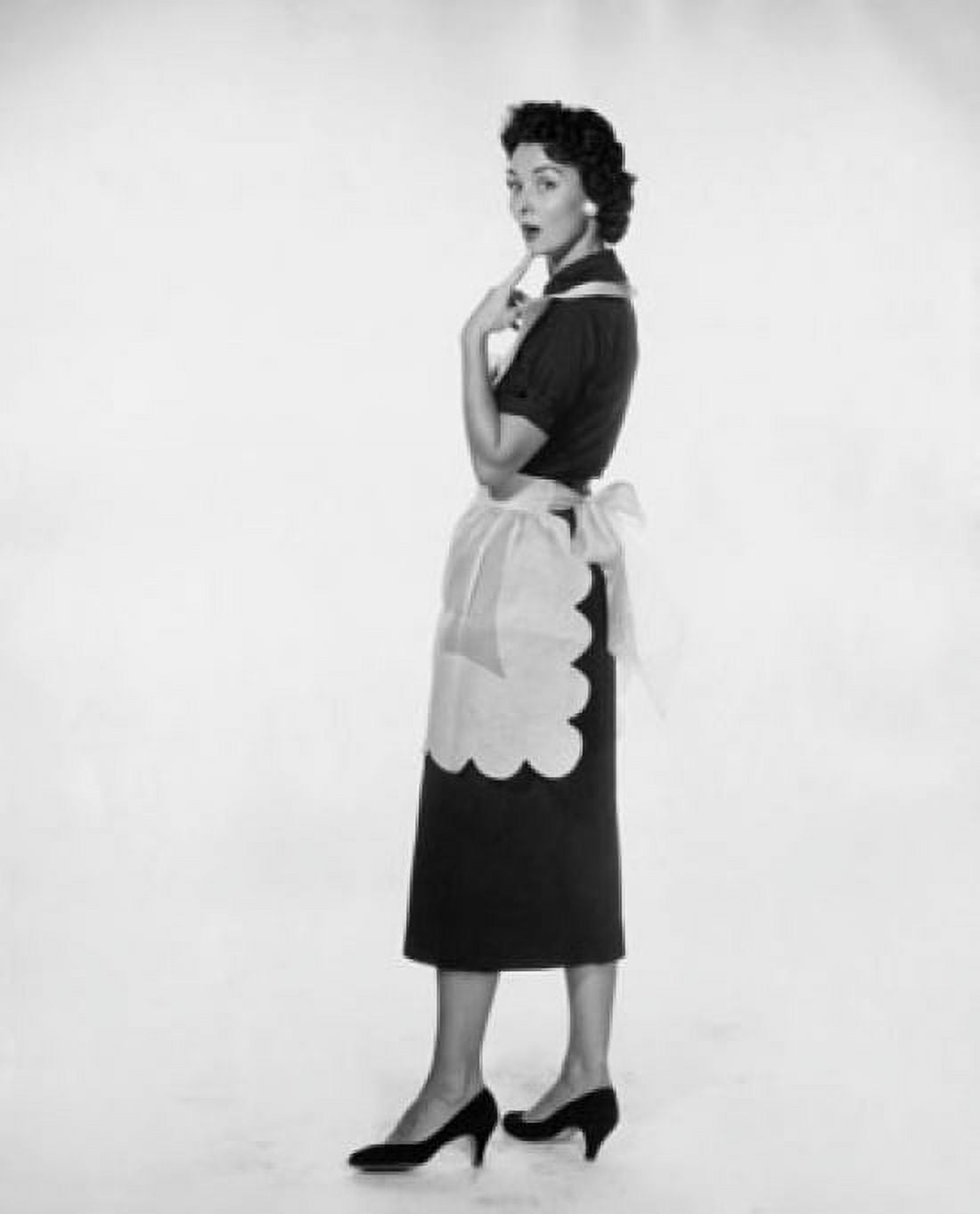 Studio shot of young woman standing with finger on chin Canvas Art - (18 x 24)