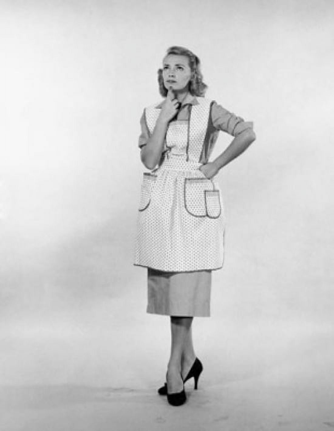 Studio shot of young woman standing with hand on chin Canvas Art - (24 x 36)