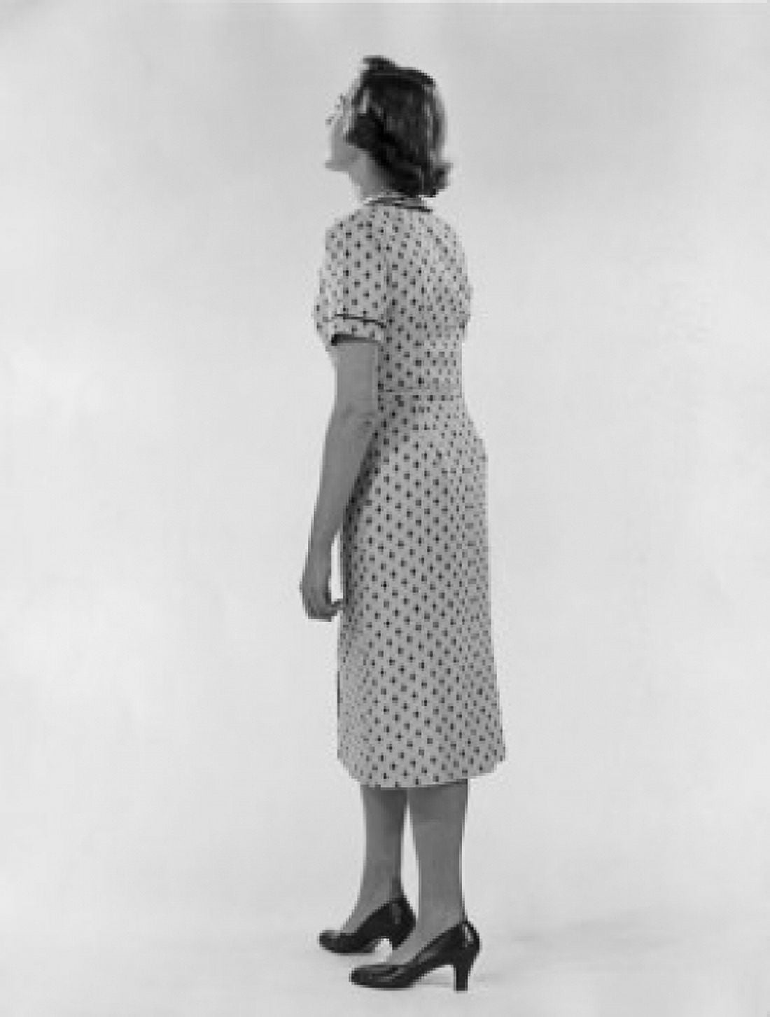 Studio shot of young woman wearing spotted dress Canvas Art - (24 x 36)