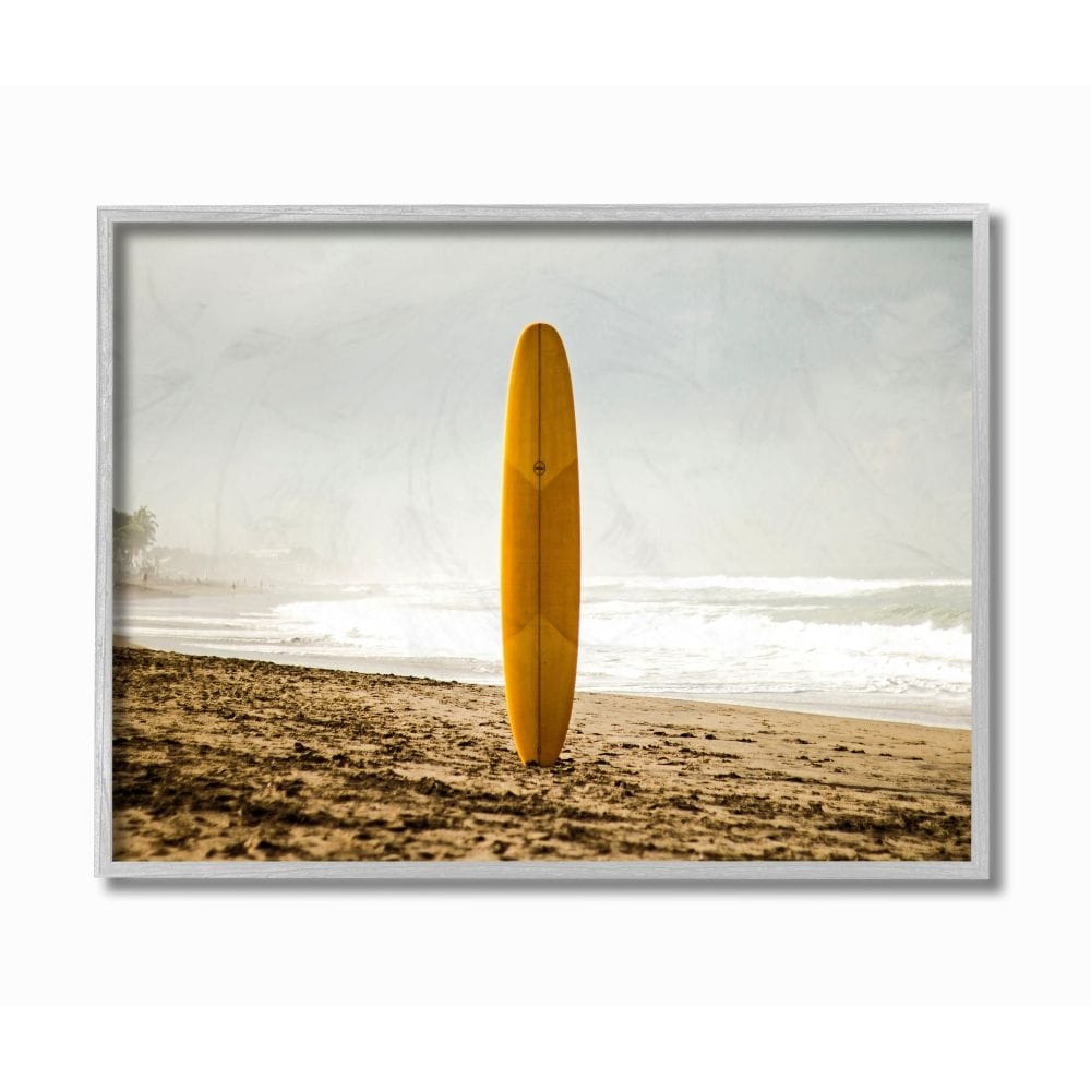 Stupell Industries Yellow Surfboard in Sand Near Shore Photograph Designed by Unsplash