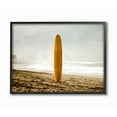 thumbnail image 1 of Stupell Industries Yellow Surfboard in Sand Near Shore Photograph Designed by Unsplash, 1 of 5