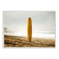 thumbnail image 1 of Stupell Industries Yellow Surfboard in Sand Near Shore Photograph Designed by Unsplash, 1 of 6