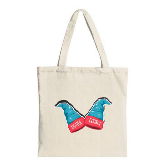 Stylish canvas tote bag with two blue hats and red bases featuring ' LEADER ' in white on a light beige background Perfect for shopping and travel