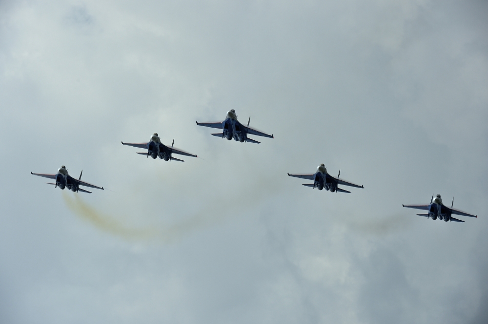 Sukhoi Su-27 Flanker aircraft of the Russian Knights aerobatic team Canvas Art - Remo GuidiStocktrek Images (18 x 12)