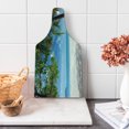 thumbnail image 1 of Summer Cutting Board, Tropical Beach Ocean Behind Palm Tree Caribbean Exotic Holiday Image, Decorative Tempered Glass Cutting and Serving Board, Wine Bottle Shape, Fern Green Sky Blue, by Ambesonne, 1 of 1