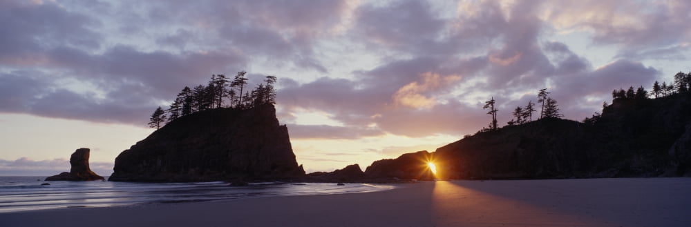 Sun light coming through an arch at sunset on 2nd Beach in Olympic National Park WA Canvas Art - Panoramic Images (27 x 9)