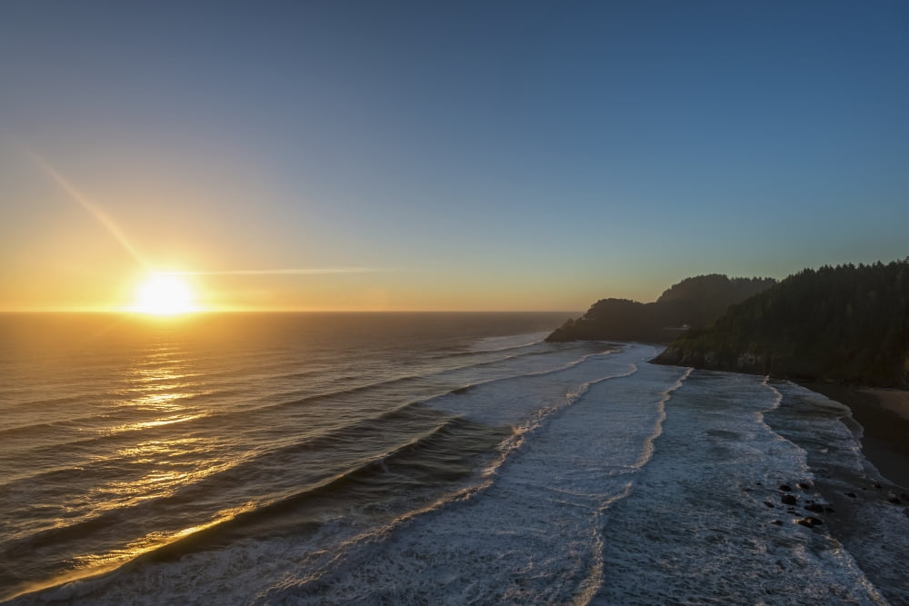 Sun setting along the Oregon Coast Oregon United States of America Canvas Art - Remsberg Inc Design Pics (19 x 12)