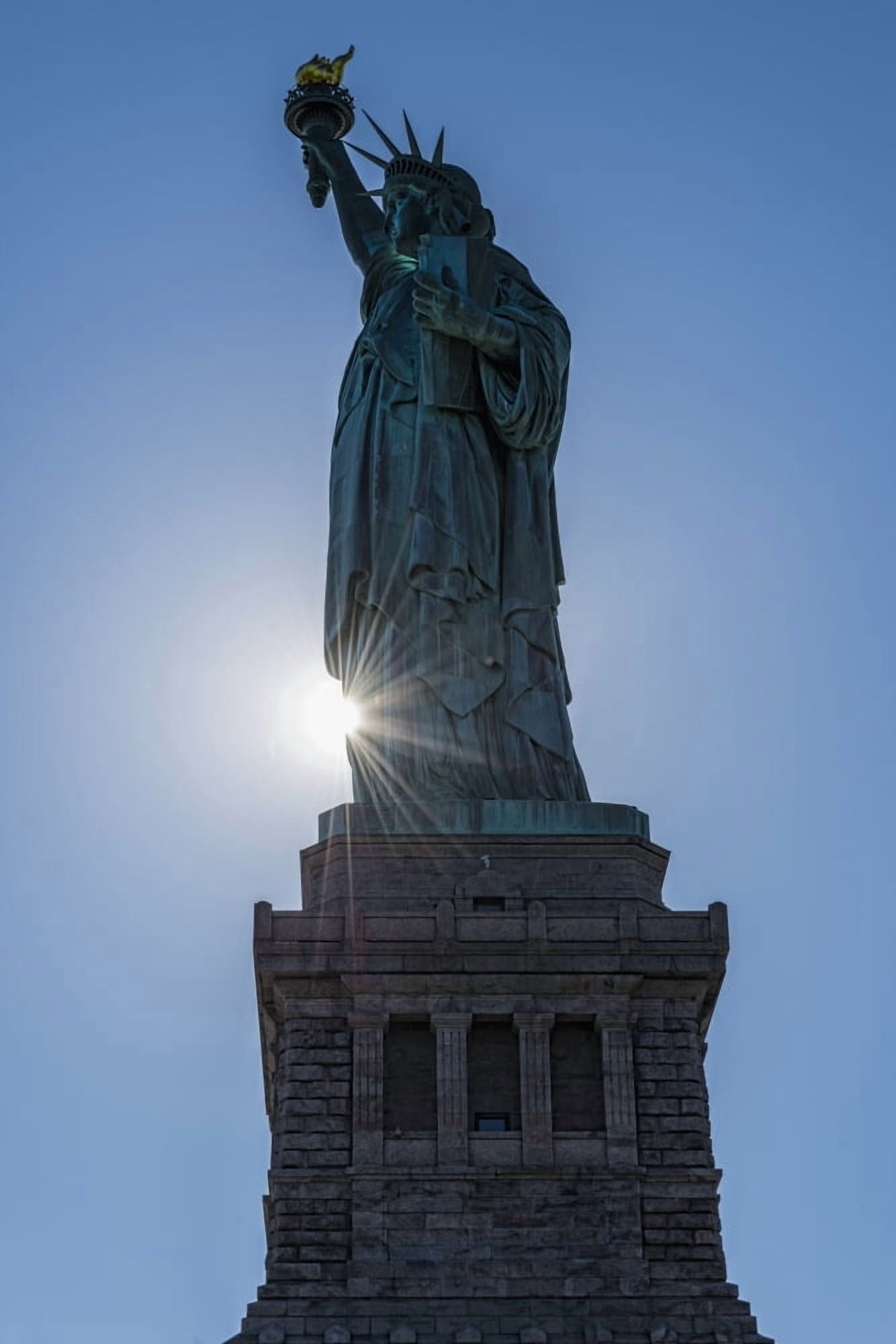 Sun setting behind the Statue of Liberty Liberty Island New York City New York United States of America Canvas Art - F M Kearney Design Pics (12 x 19)