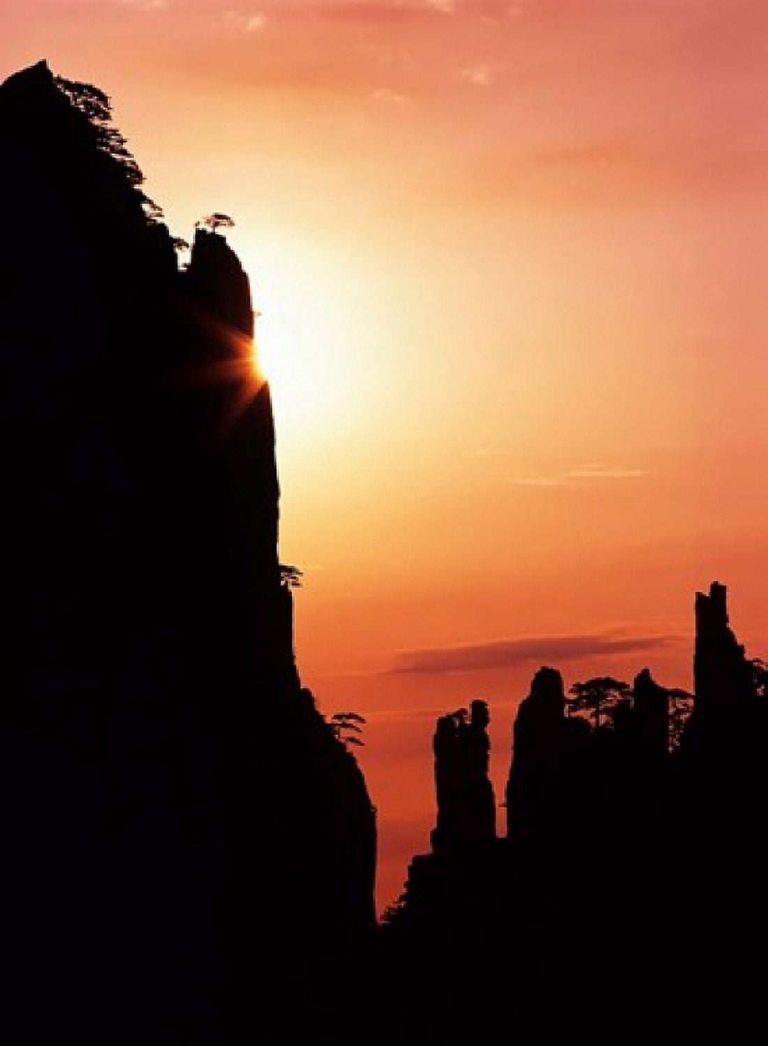 Sunburst on Craggy Huangshan Peaks Anhui China Canvas Art - Charles Crust DanitaDelimont (25 x 33)