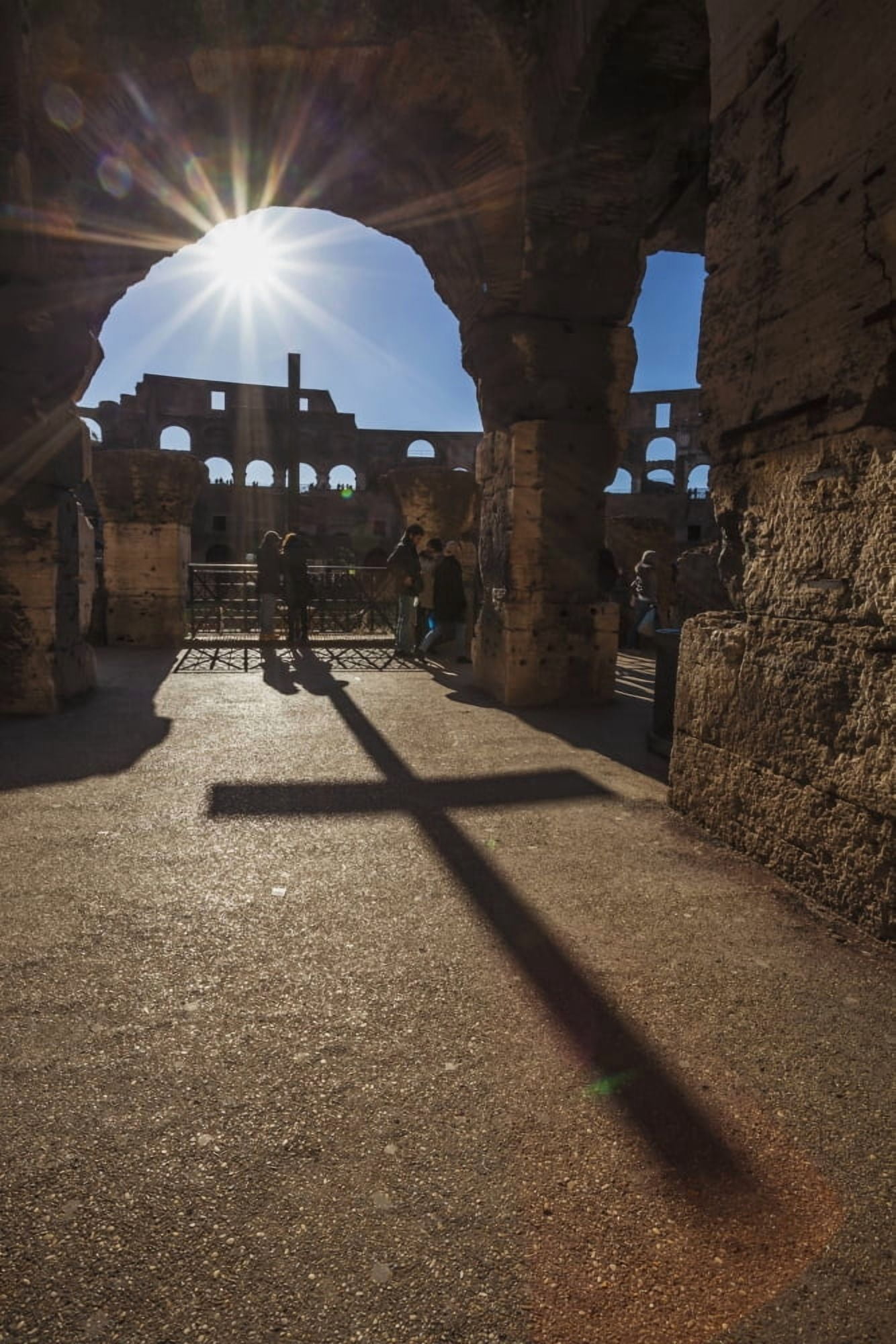 Sunburst through an archway at the Colosseum and a shadow of a cross Rome Italy Canvas Art - Reynold Mainse Design Pics (12 x 19)