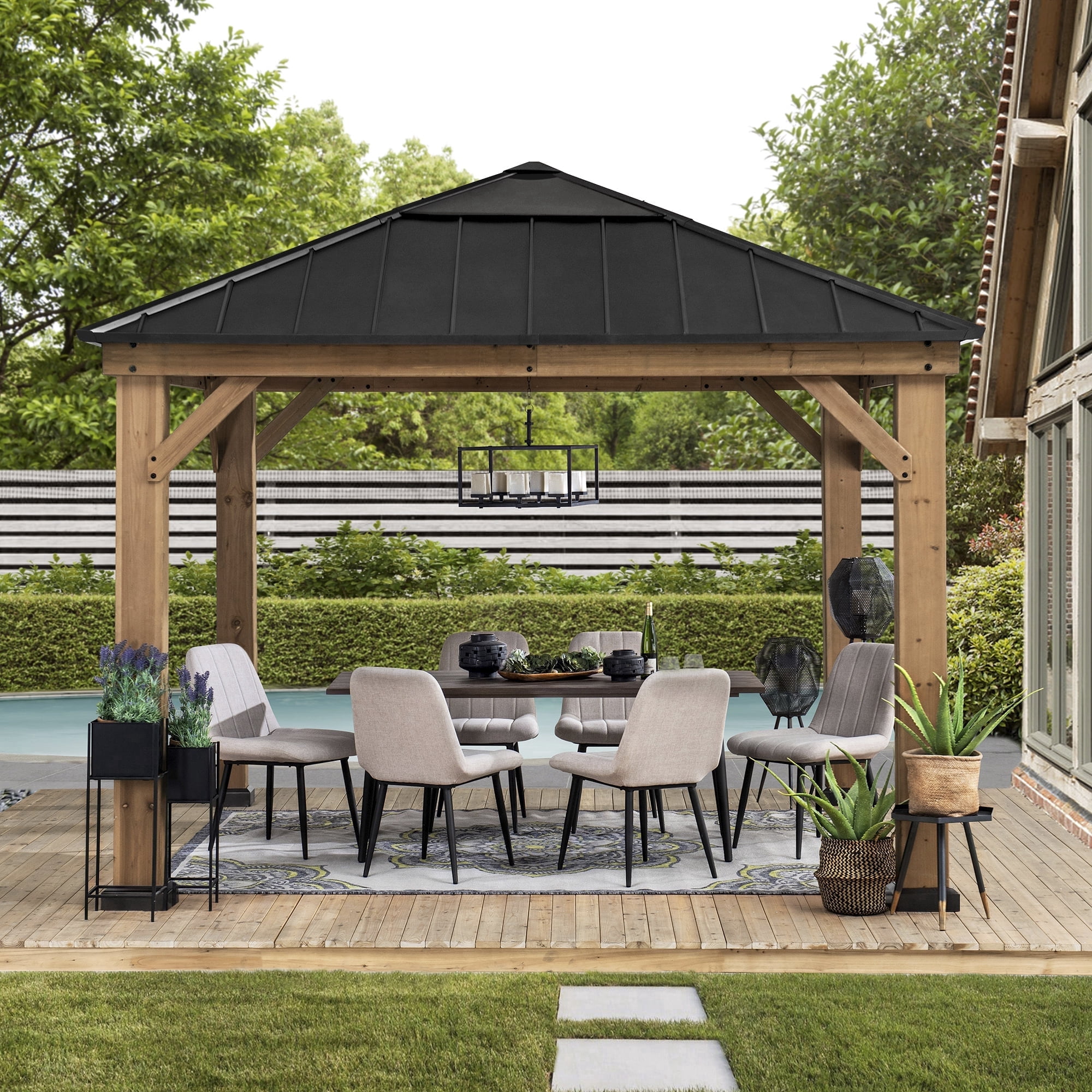 Sunjoy Paula Outdoor Patio 11 ft. x 11 ft. Cedar Framed Gazebo with Black Steel and Polycarbonate Hip Roof Hardtop