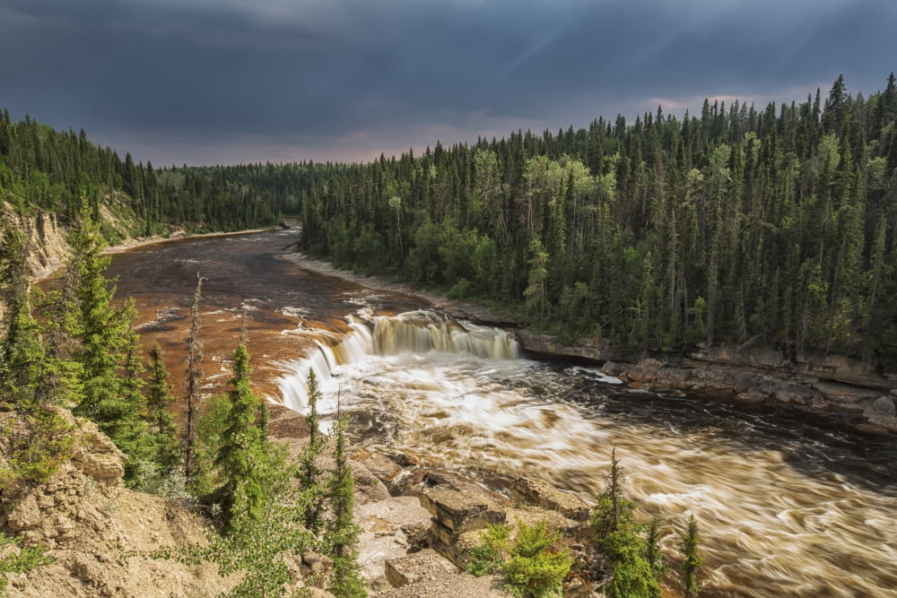 Sunlight Illuminates The Trout River Flows Over Coral Falls Northwest Territories Canada Canvas Art - Robert Postma Design Pics (19 x 12)