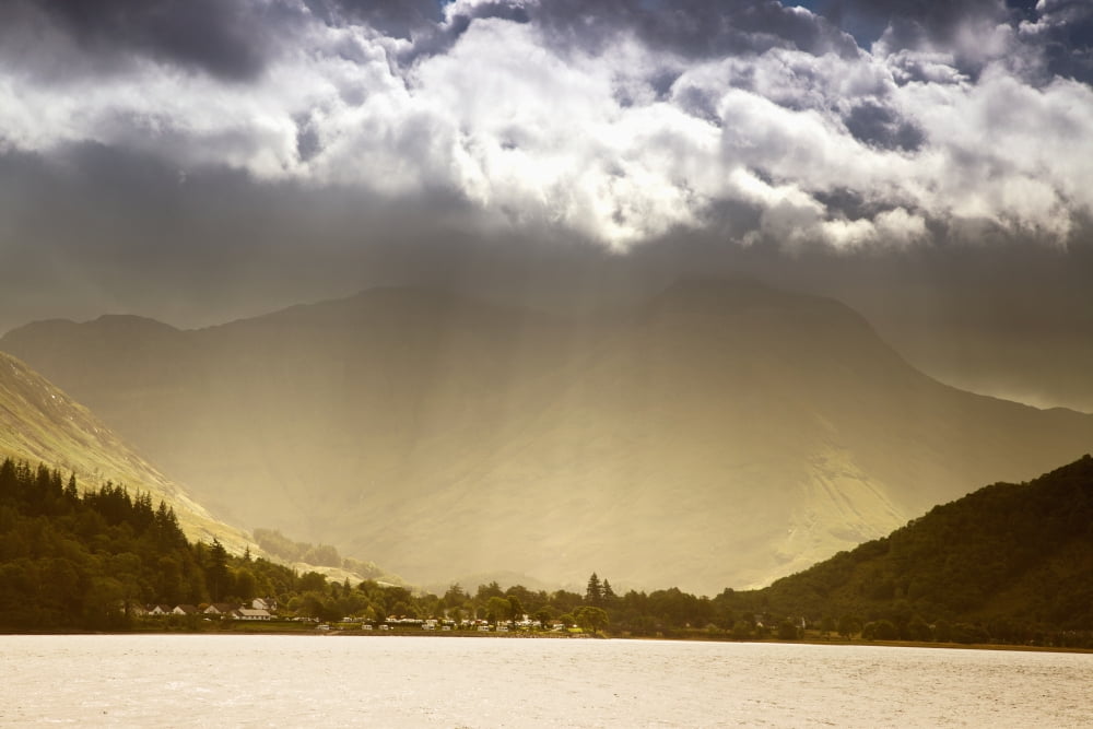 Sunlight Shining Through The Clouds Into A Glowing Valley Argyll Scotland Canvas Art - John Short Design Pics (19 x 12)