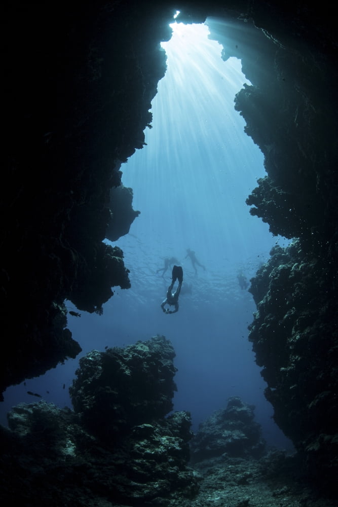 Sunlight descends underwater and into a crevice on Palaus barrier reef Canvas Art - Ethan DanielsStocktrek Images (12 x 17)