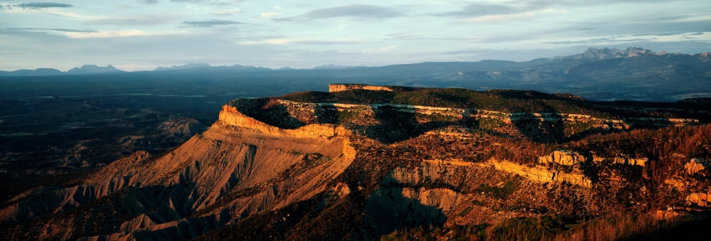 Sunlight on rock formations Park Point Overlook Mesa Verde National Park Colorado USA Canvas Art - Panoramic Images (6 x 18)
