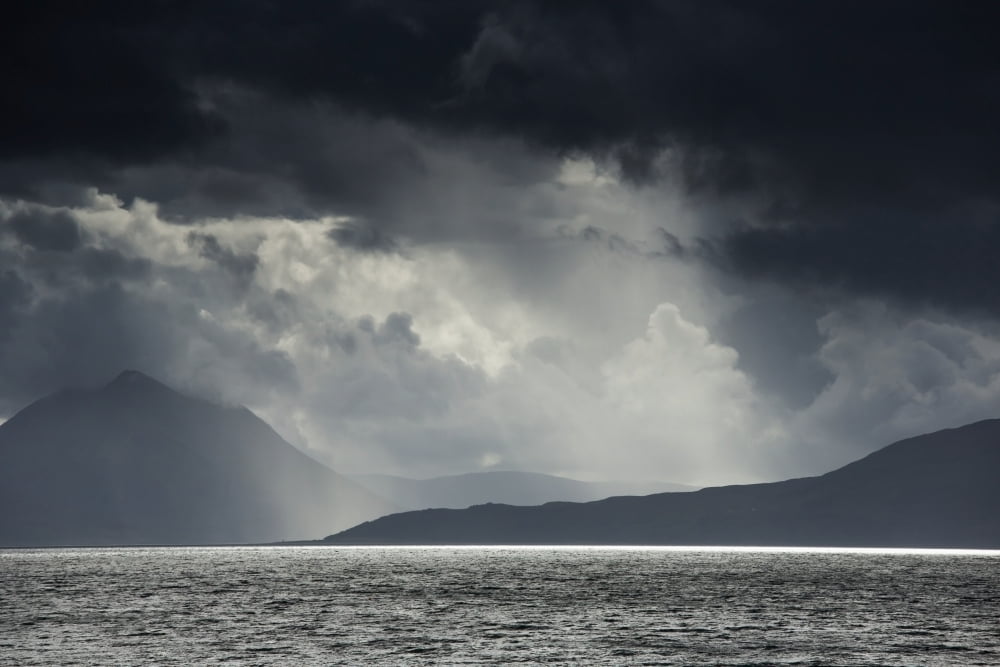 Sunlight shining through dark storm cloudsApplecross peninsula highlands scotland Canvas Art - John Short  Design Pics (19 x 12)