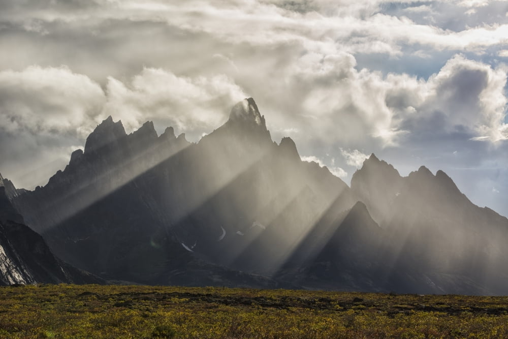 Sunlight streaks through rain and mist by Tombstone Mountain in Tombstone Territorial Park Yukon Canada Canvas Art - Robert Postma Design Pics (19 x 12)