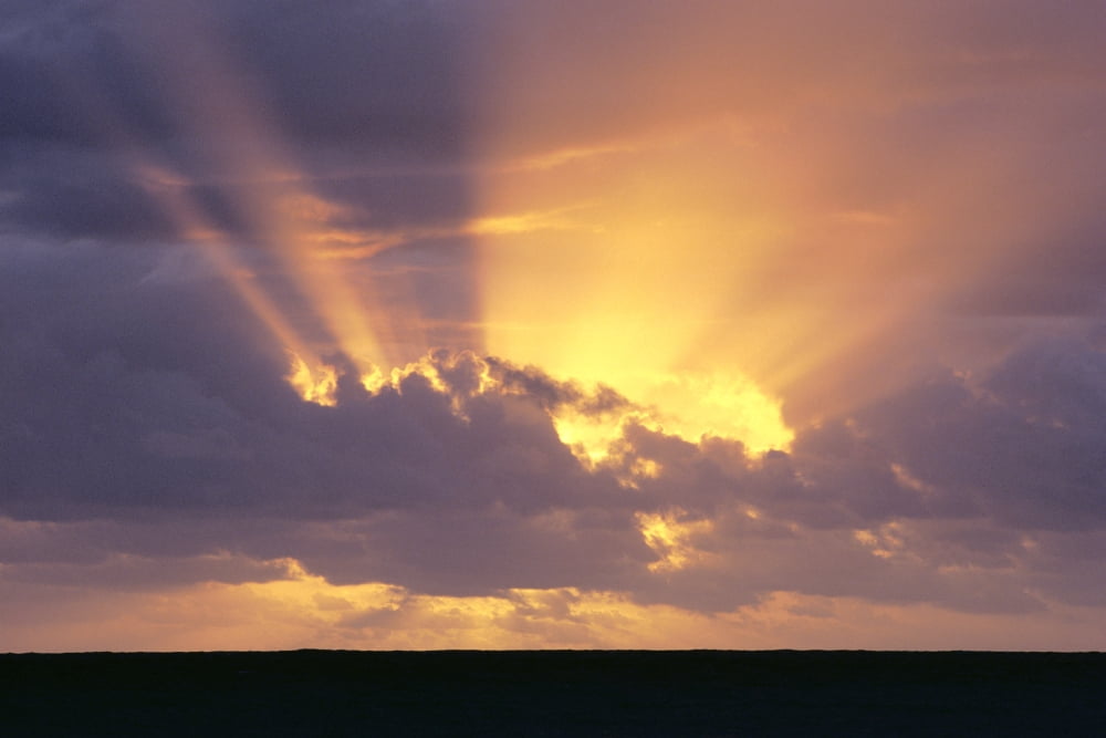 Sunrays Stream Out From Behind Clouds At Sunset Over Dark Ocean Canvas Art - Brent Black Design Pics (38 x 24)
