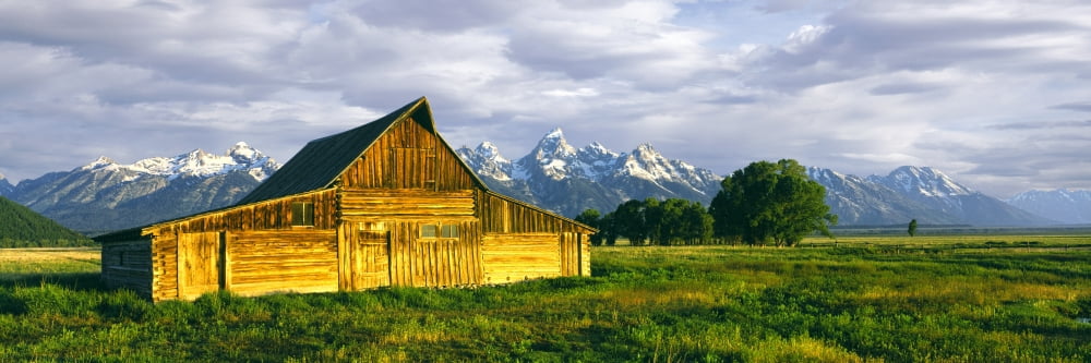 Sunrise over the Moulton Barn along Mormon Row Teton Range Mormon Row Historic District Grand Teton National Park Wyoming USA Canvas Art - Panoramic Images (27 x 9)