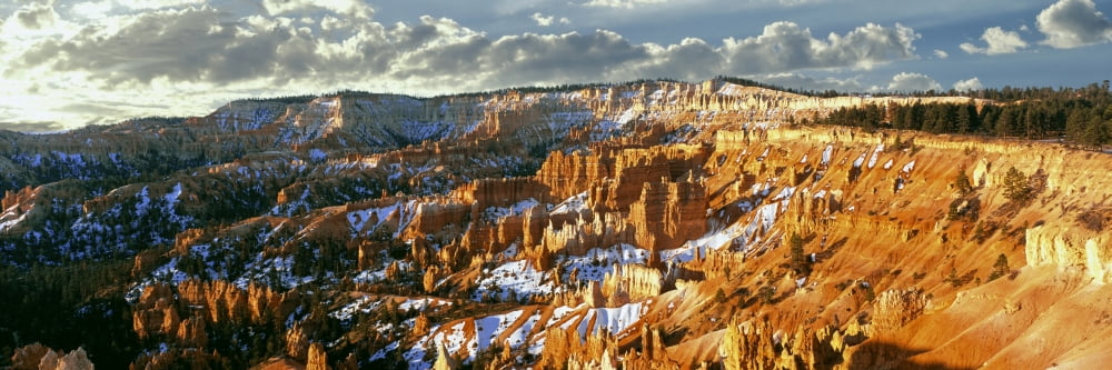 Sunrise near the spring equinox ignites the Hoodoos at Bryce Canyon In Bryce Canyon National Park Utah USA Canvas Art - Panoramic Images (27 x 9)