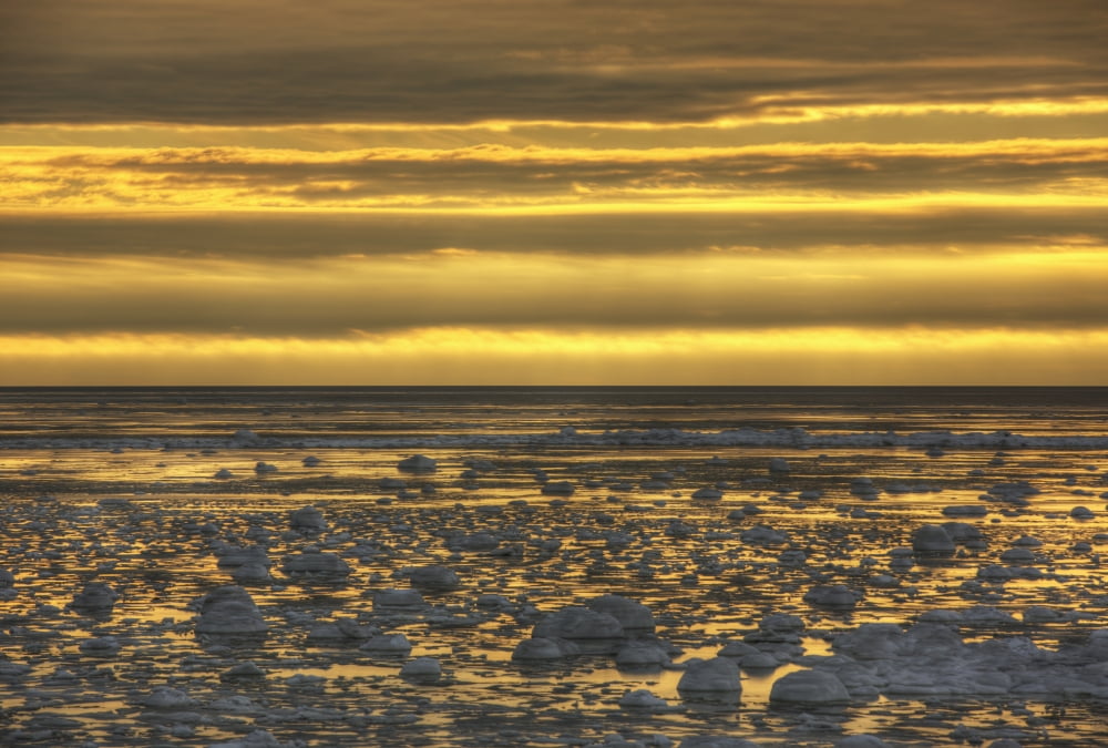 Sunrise over an ice filled bay of hudsons bayManitoba canada Canvas Art - Robert Postma Design Pics (36 x 24)