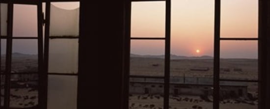 Sunrise viewed through a window Sperrgebiet Kolmanskop Namib Desert Namibia Canvas Art - Panoramic Images (30 x 12)