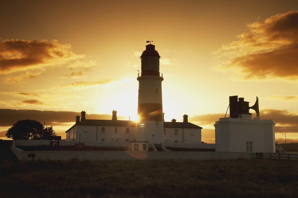 Sunset Behind Lighthouse Canvas Art - John Short Design Pics (38 x 24)