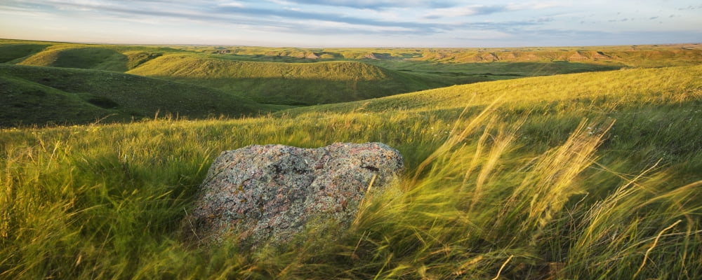 Sunset Over The Coulees And Buttes Of Grasslands National Park With Erratic In Foreground Saskatchewan Canada Canvas Art - Robert Postma Design Pics (44 x 18)
