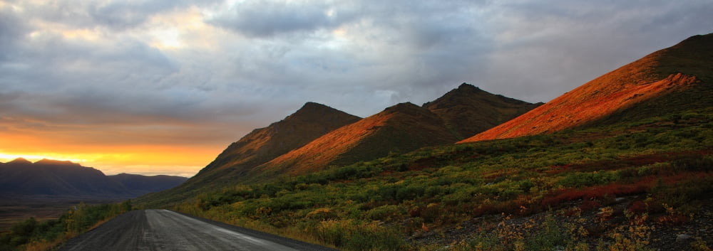 Sunset Light Hitting The Mountains Along The Desmpter Highway Yukon Canvas Art - Robert Postma Design Pics (44 x 15)