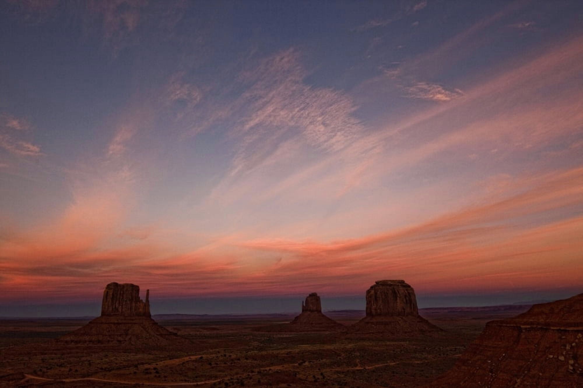 Sunset Over Monument Valley Arizona Canvas Art - Robert Postma Design Pics (34 x 22)