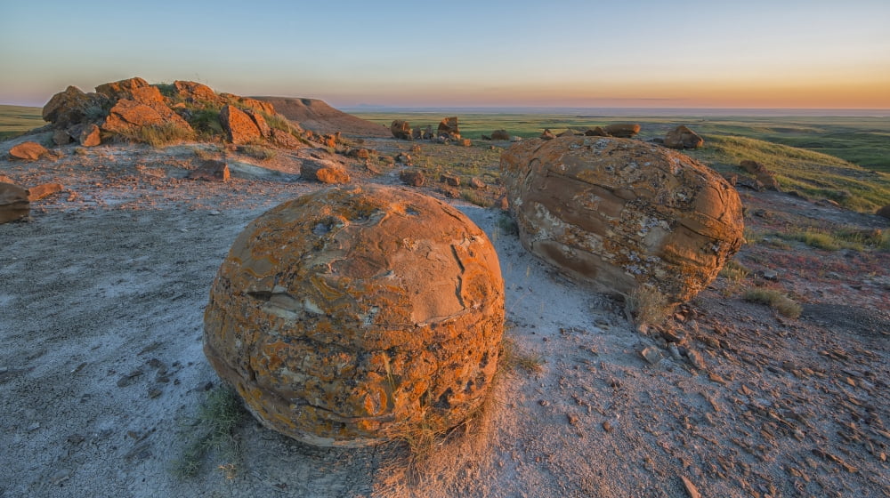 Sunset Over The Rocks At Red Rock Coulee Alberta Canada Canvas Art - Robert Postma Design Pics (40 x 22)
