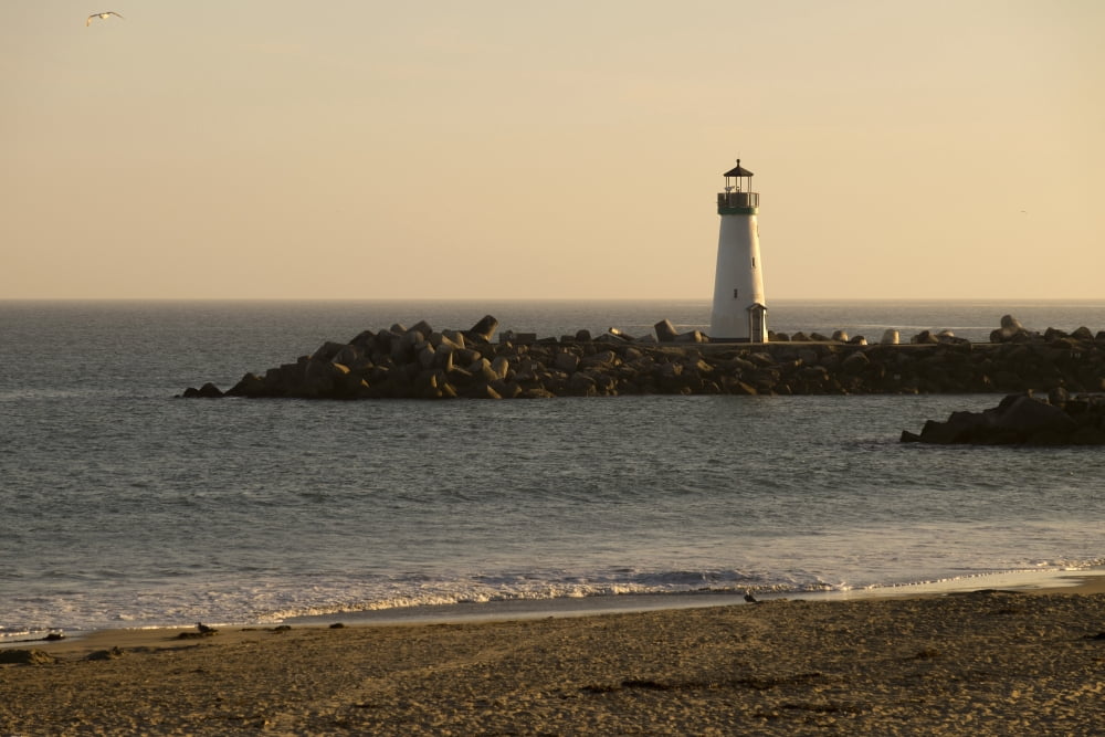 Sunset over the Walton Lighthouse at the Santa Cruz Harbor and Monterey Bay California United States of America Canvas Art - Gina Bringman Design Pics (38 x 24)