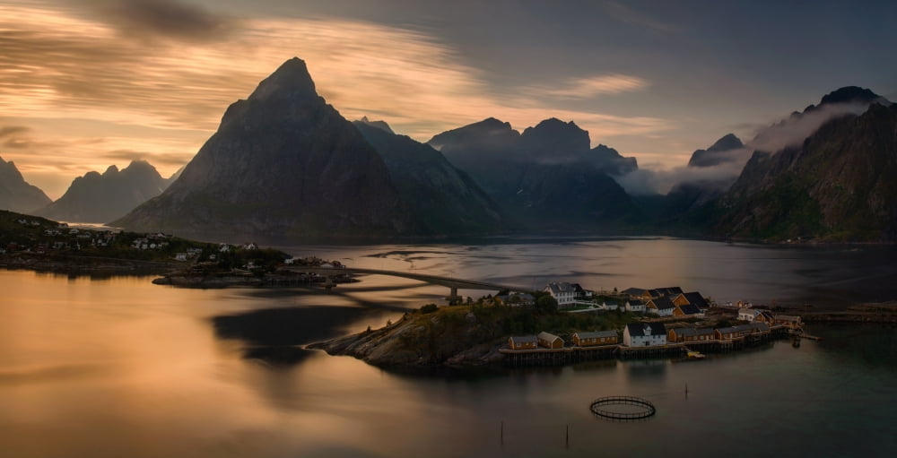 Sunset above Sakrisoya village with mountains ridge in background Lofoten Nordland Norway Canvas Art - Panoramic Images (12 x 24)