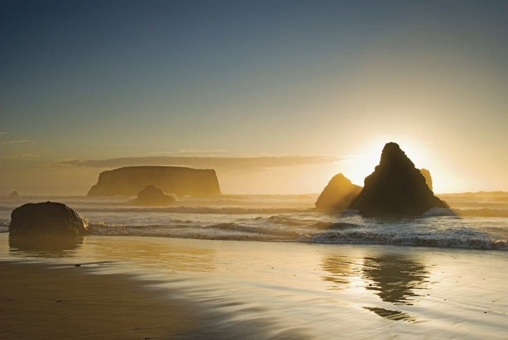 Sunset behind offshore rocksBandon oregon united states of america Canvas Art - Philippe Widling  Design Pics (36 x 24)