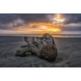 thumbnail image 1 of Sunset lights up the sky along the coast of Oregon with huge pieces of driftwood lay scattered across the beach; Oregon United States of, 1 of 3
