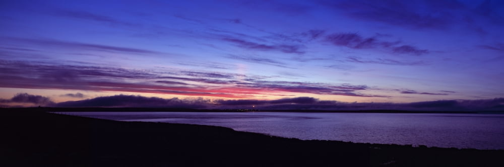 Sunset over Scapa Flow overlooking the oil terminal at Flotta Orkney Islands Scotland Canvas Art - Panoramic Images (27 x 9)