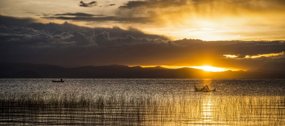 Sunset over a lake Copacabana Lake Titicaca Bolivia Canvas Art - Panoramic Images (27 x 9)