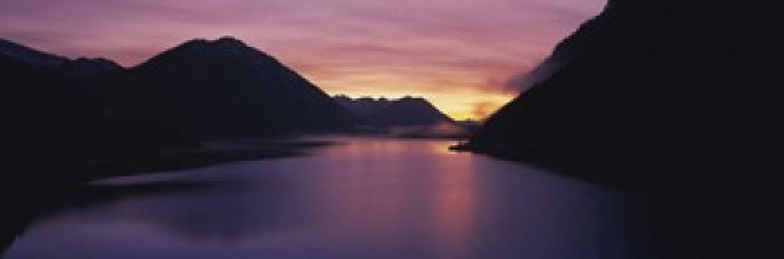 Sunset over a lake Sylvenstein Lake Bavarian Alps Germany Canvas Art - Panoramic Images (18 x 6)