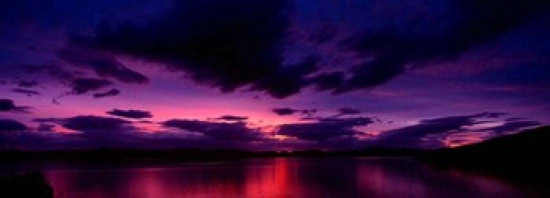 Sunset over an island viewed from Applecross Peninsula Isle of Skye Inner Hebrides Hebrides Scotland Canvas Art - Panoramic Images (18 x 7)