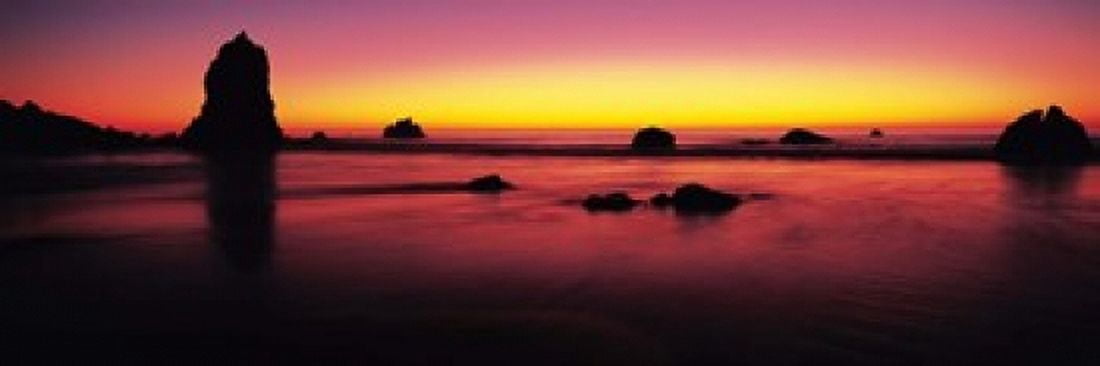 Sunset over rocks in the ocean Big Sur California USA Canvas Art - Panoramic Images (18 x 6)