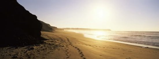 Sunset over the beach Lagos Faro District Algarve Portugal Canvas Art - Panoramic Images (36 x 13)