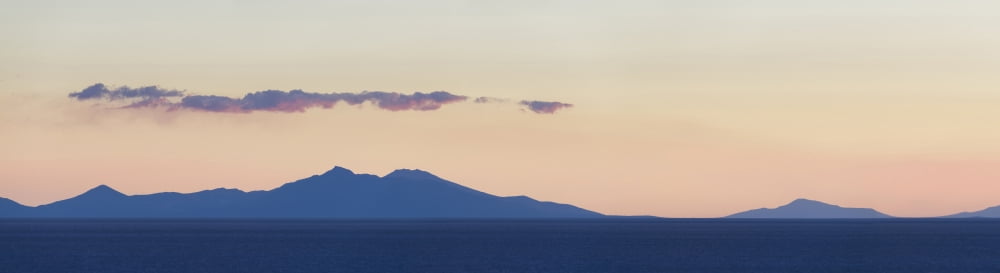 Sunset over the vast salt flat of the Salar de Uyuni Potosi Department Bolivia Canvas Art - Panoramic Images (27 x 9)