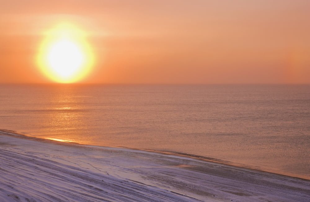 Sunset through windblown snow creates a sundog above the Beaufort Sea along the coast just outside of Barrow Winter Arctic Alaska USA Canvas Art - Kevin Smith Design Pics (19 x 12)