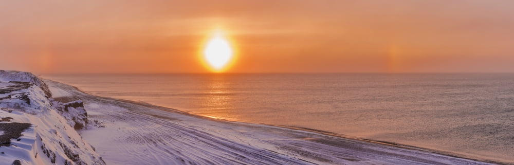 Sunset through windblown snow creates a sundog above the Beaufort Sea along the coast just outside of Barrow Winter Arctic Alaska USA Canvas Art - Kevin Smith Design Pics (38 x 12)