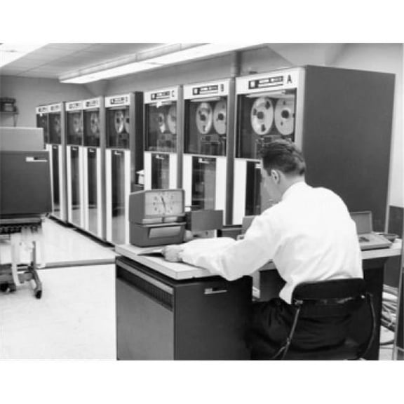 Superstock SAL25512994 Rear View of A Businessman Sitting in A Computer Lab Poster Print, 18 x 24