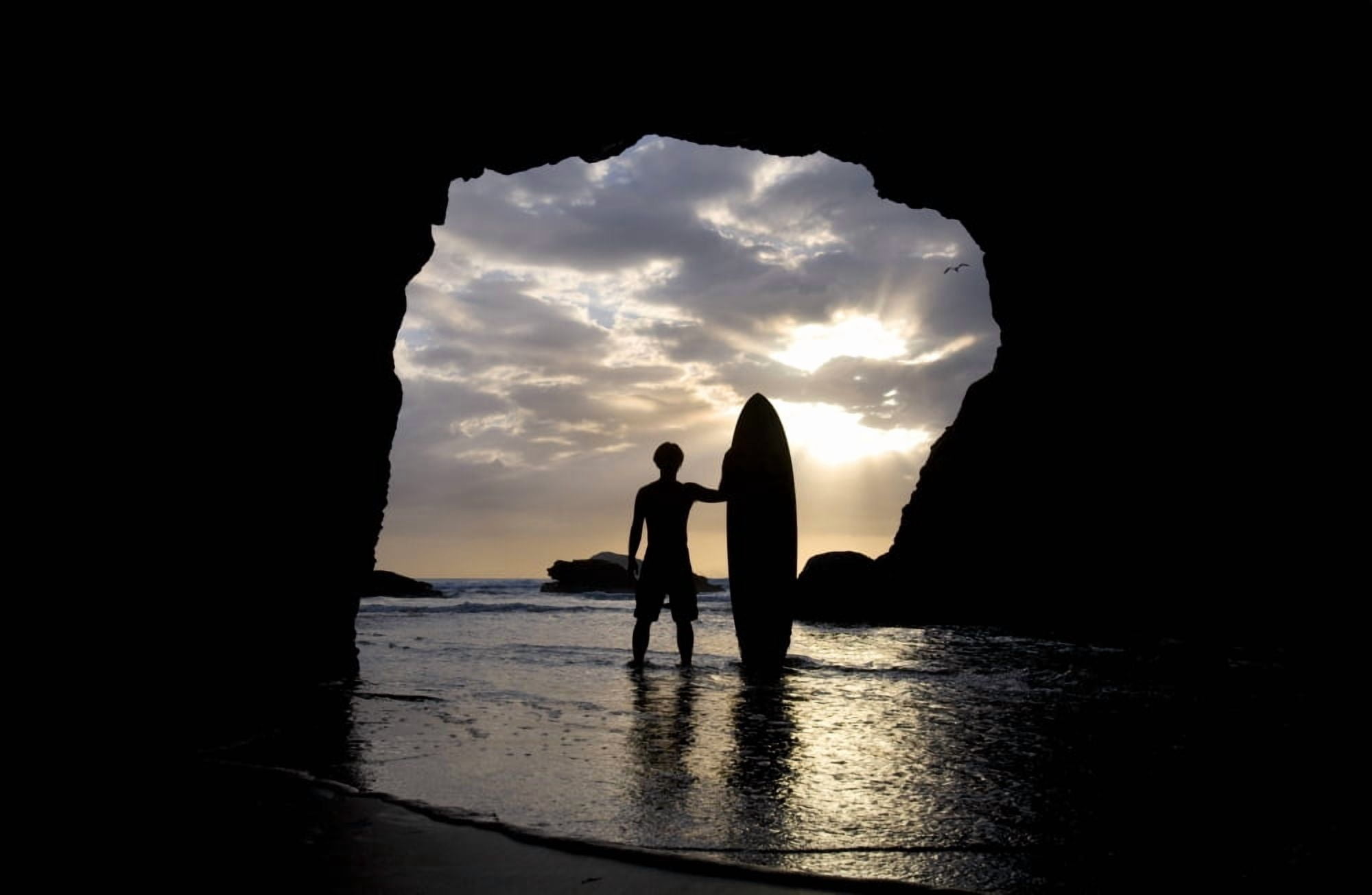 Surfer Inside A Cave At Muriwai New Zealand Canvas Art - Deddeda Design Pics (17 x 11)